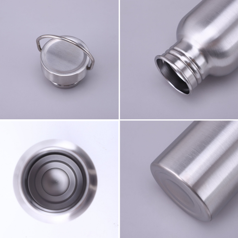Close-up details of a stainless steel water bottle on a gray background